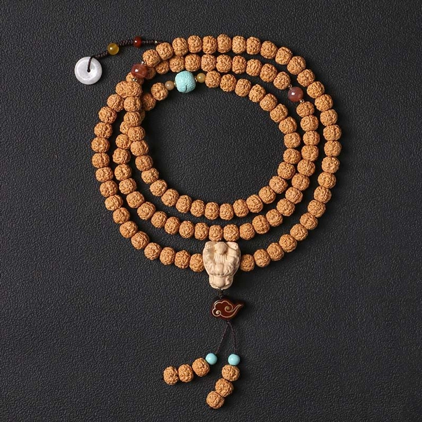Bodhi seed Buddhist prayer bracelet with Vajra Bodhi beads and protective three-eye Dzi bead charm