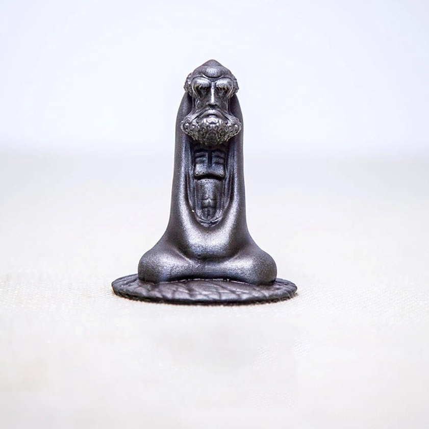 Bodhidharma polished version statue refined finish front view on wooden surface