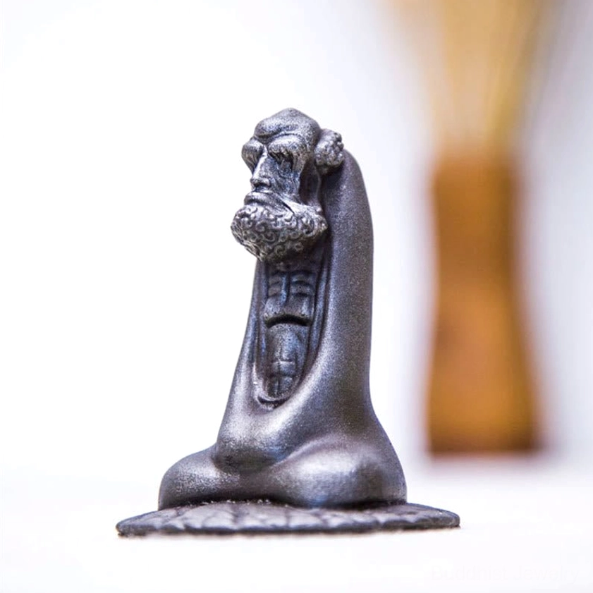 Bodhidharma resin statue side view displaying meditating monk silhouette and rusty texture