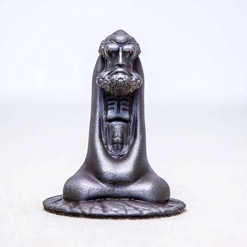 Bodhidharma statue detailed view highlighting beard carving and facial expressions