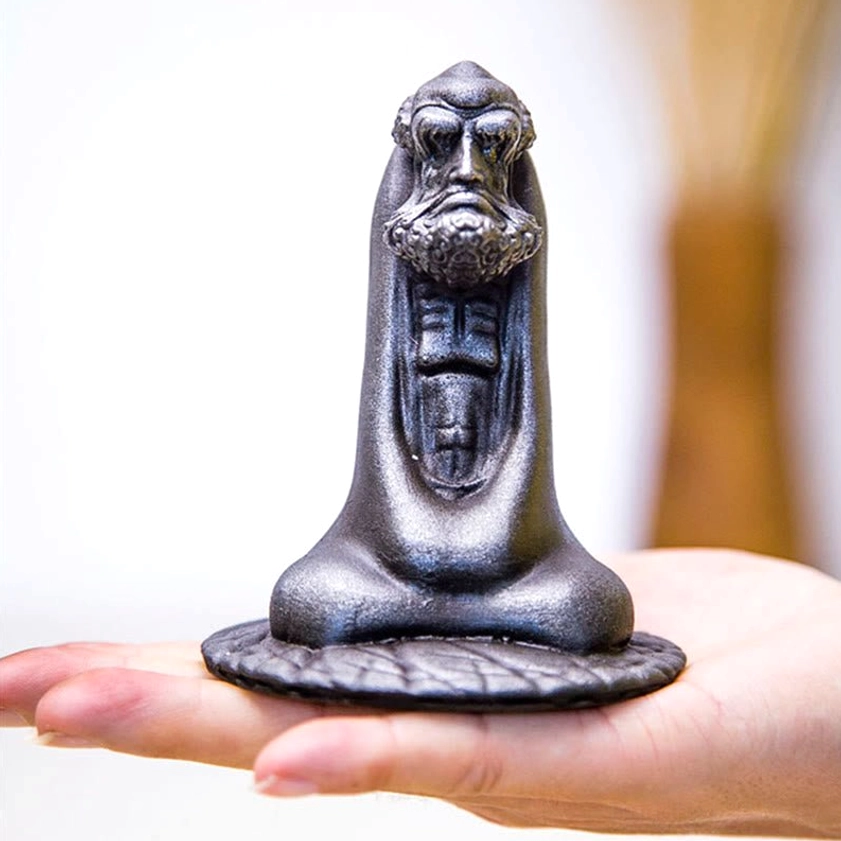 Bodhidharma statue iron powder resin material close-up showing texture and material quality
