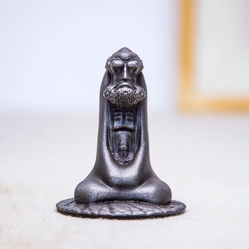 Bodhidharma iron resin statue showing rust patina development and aging character