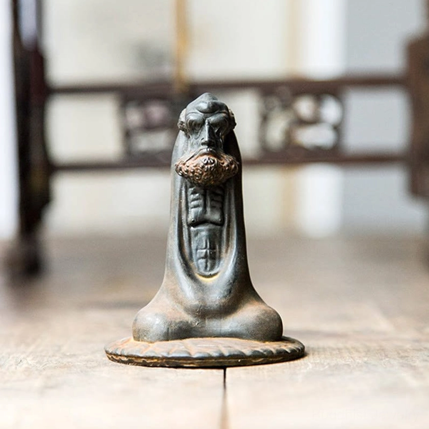 Bodhidharma iron powder resin statue alternative angle showing rustic brown finish and texture