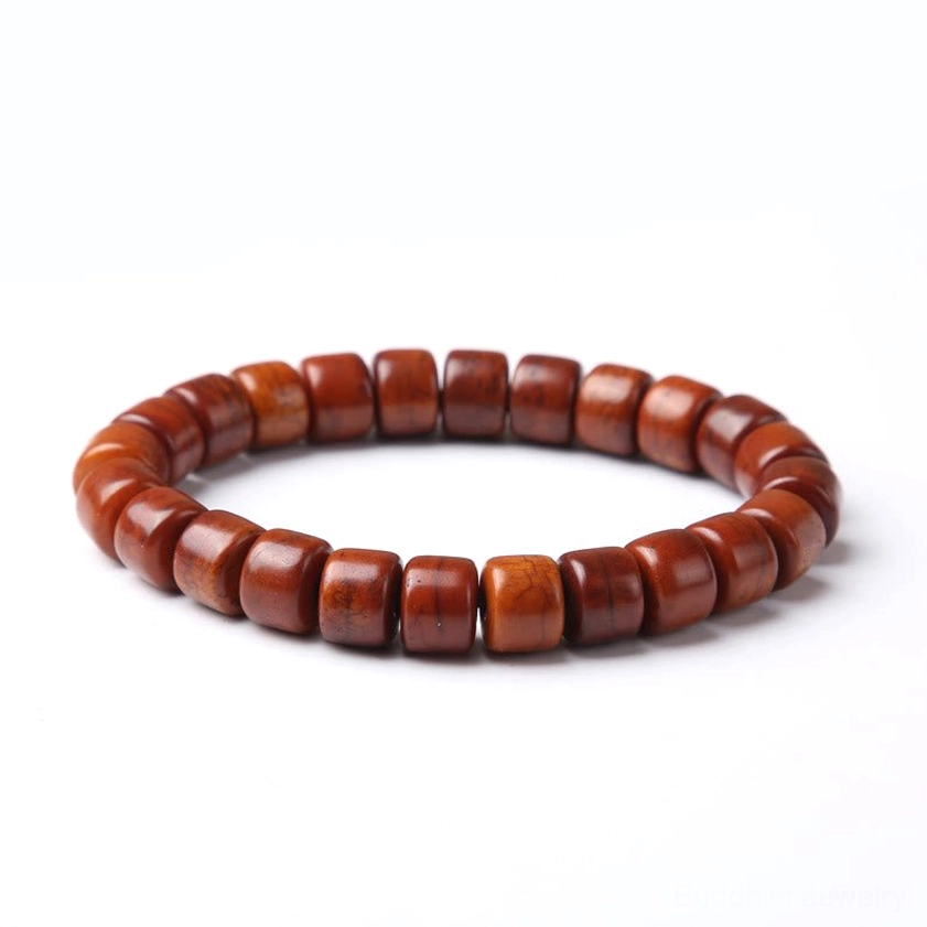Plain bone bead bracelet without dzi accent polished cylindrical beads white studio background