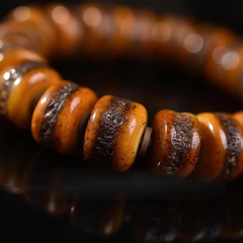Macro close-up of weathered bone bead texture with natural crack patterns – detailed side view showing vintage patina