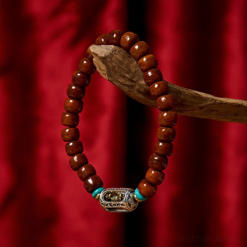 Bone beads and Vajra symbol bracelet combination showing intricate Tibetan silver Vajra bead with bone beads and red accents