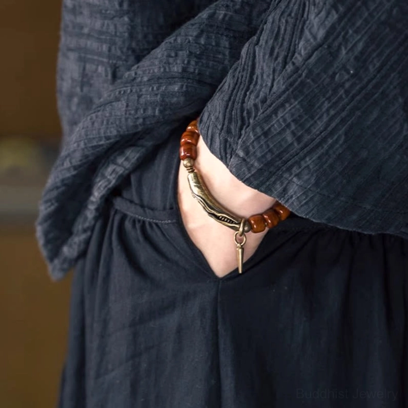 Alternative view of handcrafted bone beads copper cone pendant strength bracelet emphasizing natural material quality and artisan craftsmanship