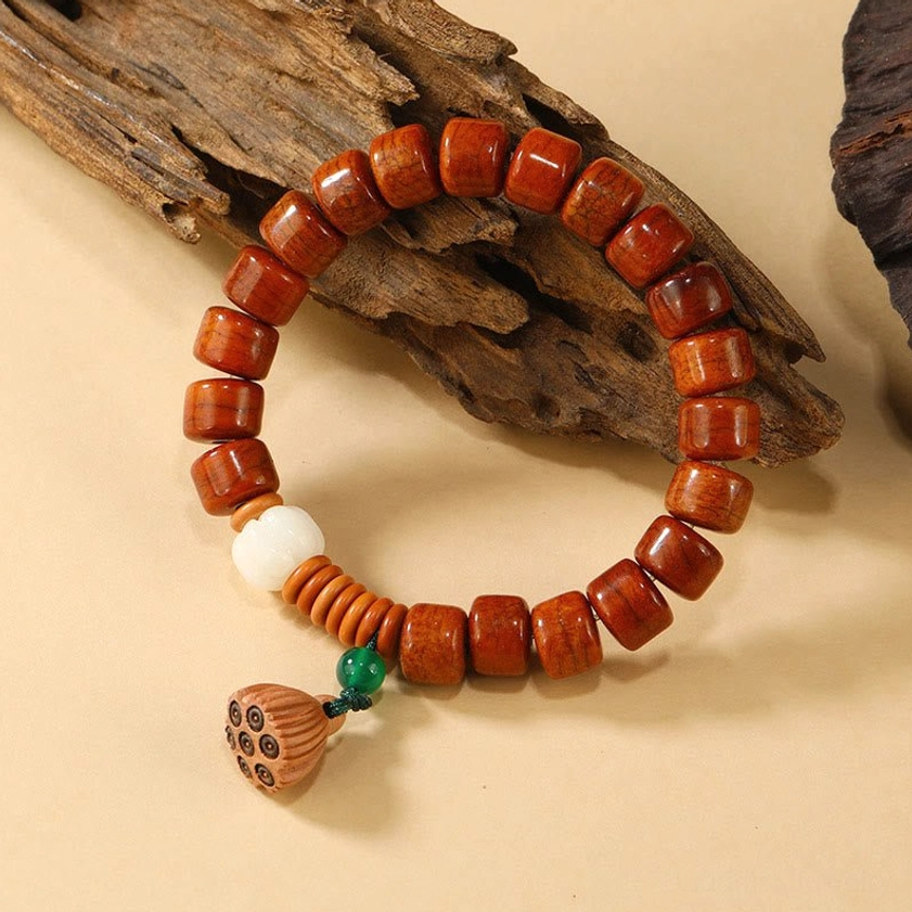 Buddhist meditation bracelet with bone beads and lotus pod pendant angled display