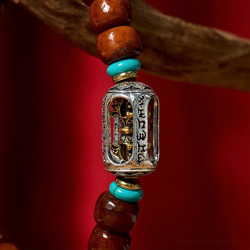 Bone beads, three-eye Dzi bead, and alloy bracelet combination showing complete design with turquoise spacers and Tibetan silver elements