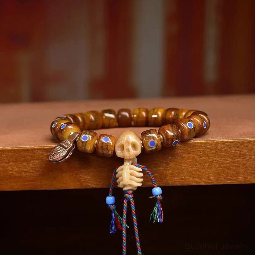 Traditional bone skull bracelet flat lay overhead view showing complete design and spiritual symbolism