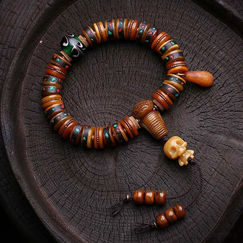 Tibetan bone bead mala bracelet with dual skull charms and colorful accents, spiritual Buddhist jewelry set