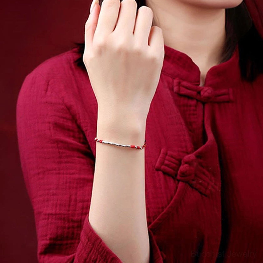 Handmade Buddhist string bracelet detail showing intricate weaving and craftsmanship