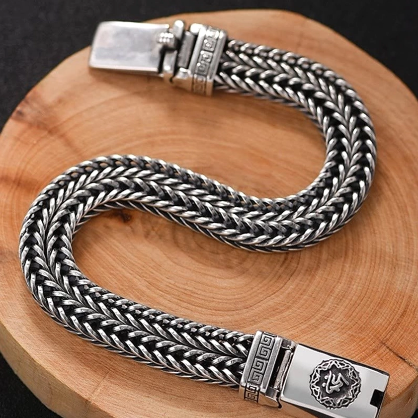 Hand-braided copper Buddhist bracelet side angle detail showing double strand twisted texture and vintage patina finish