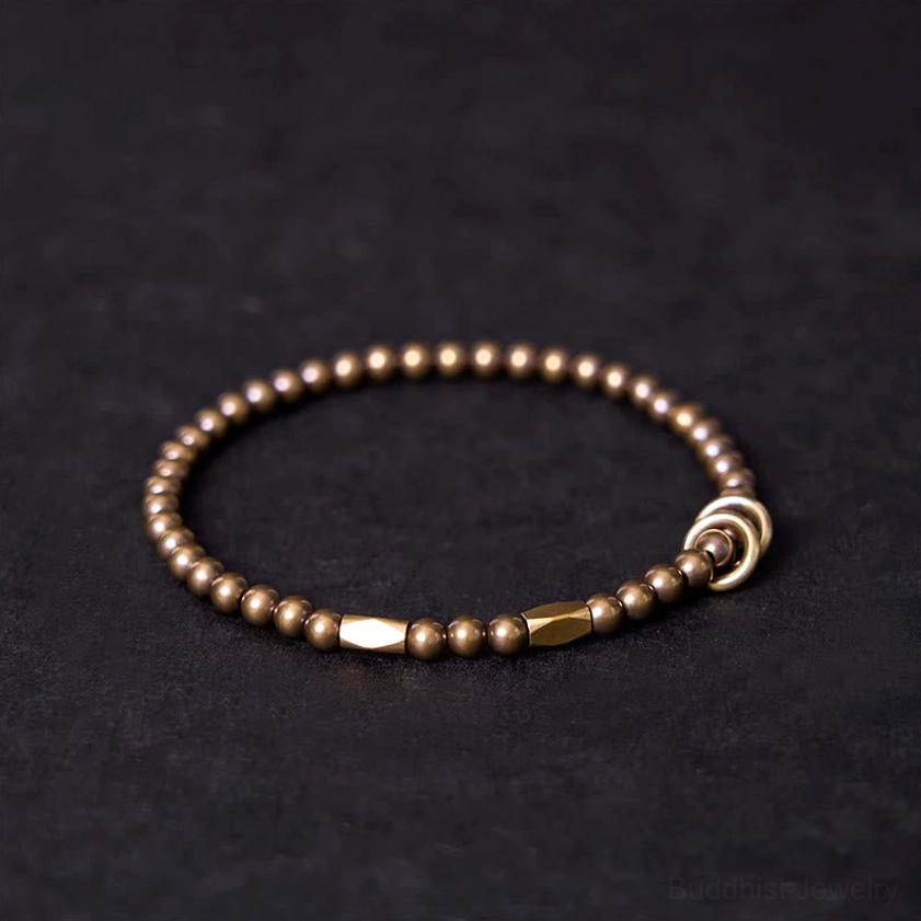 Copper brass beaded couple bracelet featuring small round beads with long flat accent bead and secure toggle clasp