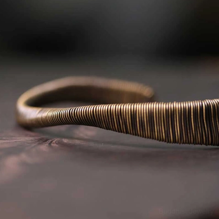 Adjustable brass cuff bracelet size comparison showing flexible open design for different wrist circumferences