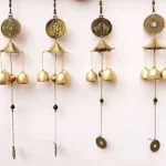 Handmade brass wind chime bell with elephant, Bagua, blessing letter and auspicious coin symbols for protection and good fortune