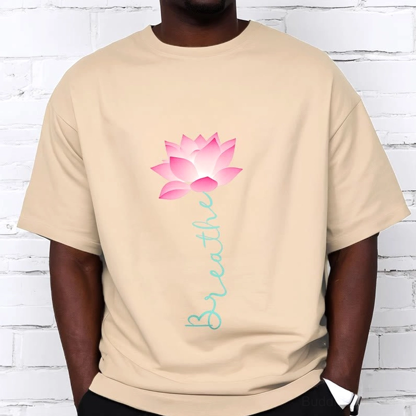 Male model wearing beige breathe lotus tee white brick wall background