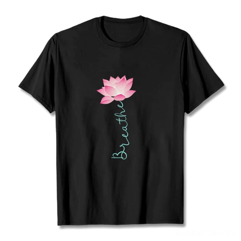 Black breathe lotus printed t-shirt flat lay design with pink lotus flower and teal text