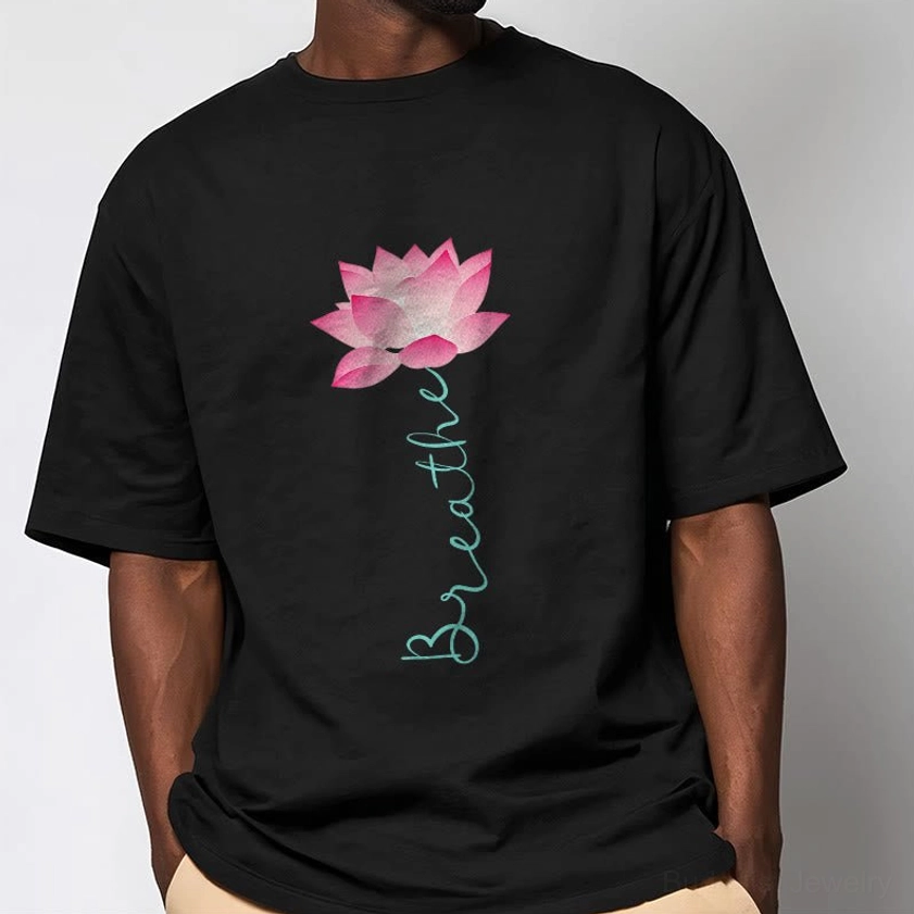 Close-up of male model in black breathe lotus tee showing soft cotton fabric quality