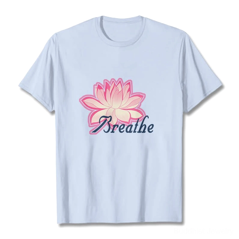 Breathe lotus flower light cyan t-shirt on male model with pink lotus graphic and dark blue text design