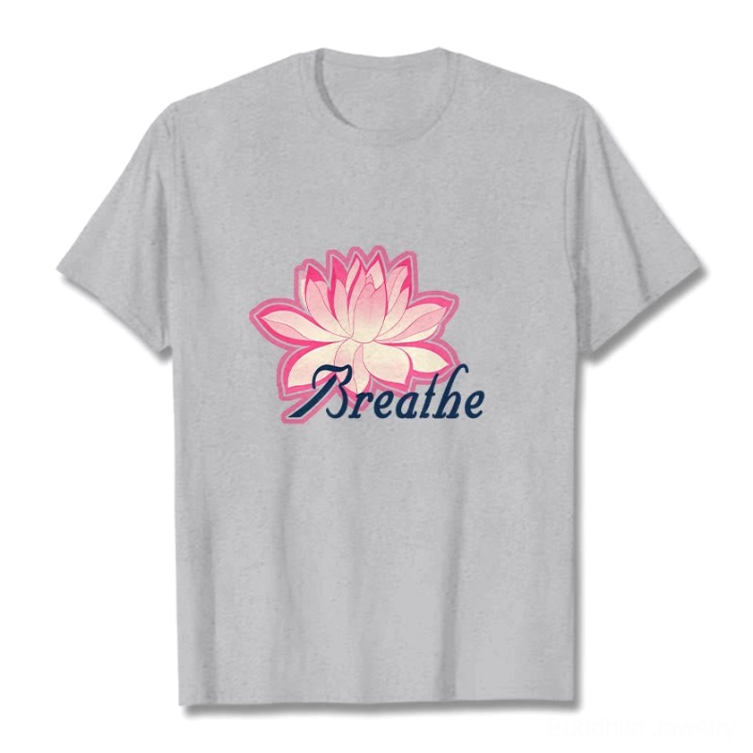 Breathe lotus flower light gray t-shirt flat lay showing full front design with pink lotus and dark blue text