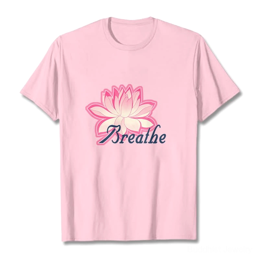 Man wearing breathe lotus flower light gray t-shirt with pink lotus graphic and dark blue breathe text print