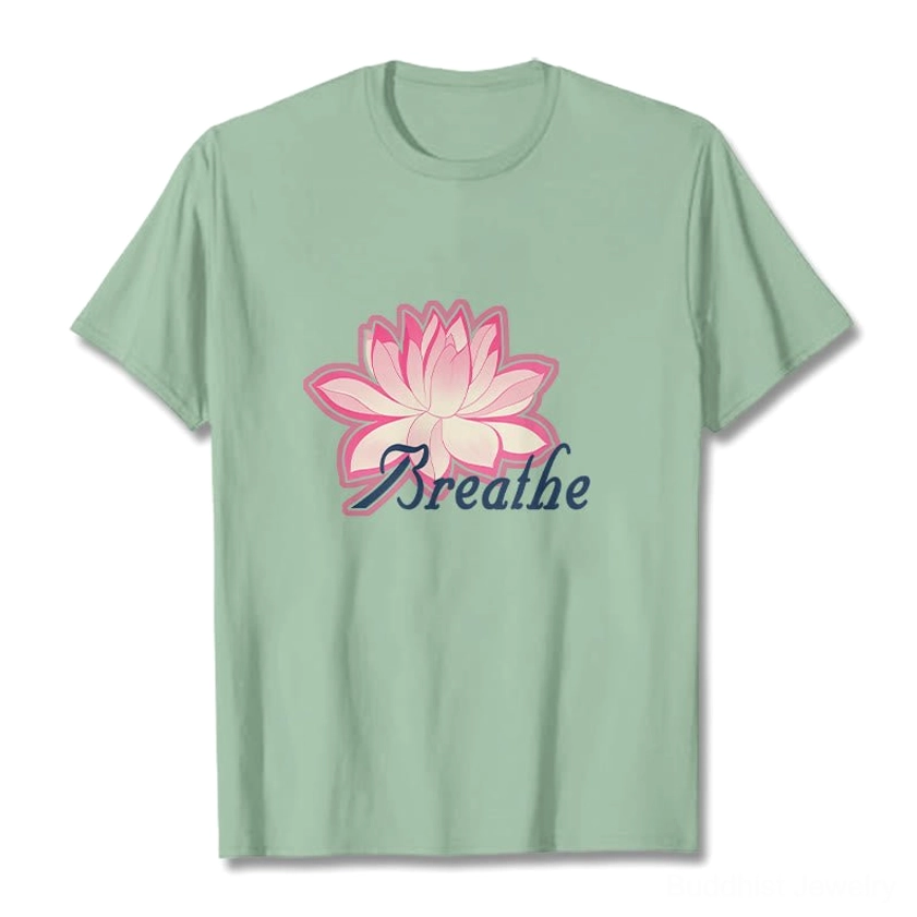 Breathe lotus flower t-shirt lifestyle model shot showing pink lotus graphic with dark blue text on front