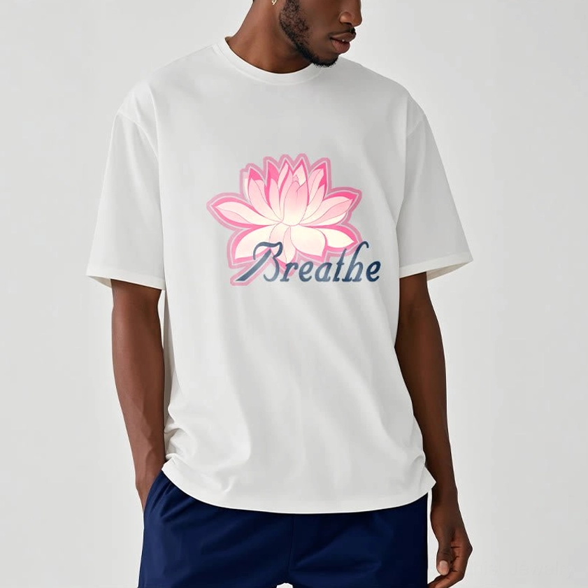 Men wearing breathe lotus flower off-white t-shirt with pink lotus and text design, indoor casual model photography