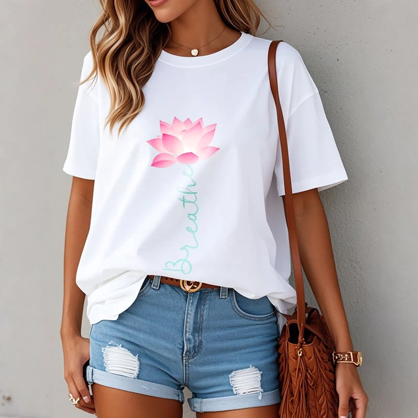 Female model wearing breathe lotus mindfulness tee with denim shorts casual style
