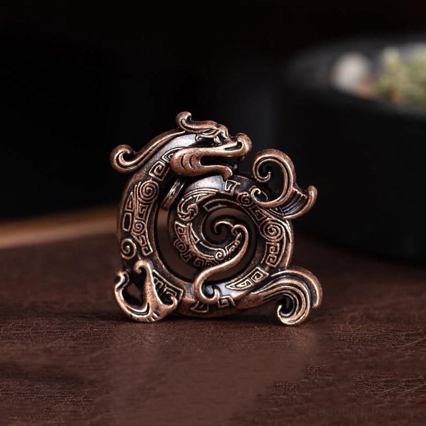 Bronze dragon incense holder with antique bronze tone and swirling dragon design, eye-level view on wooden surface