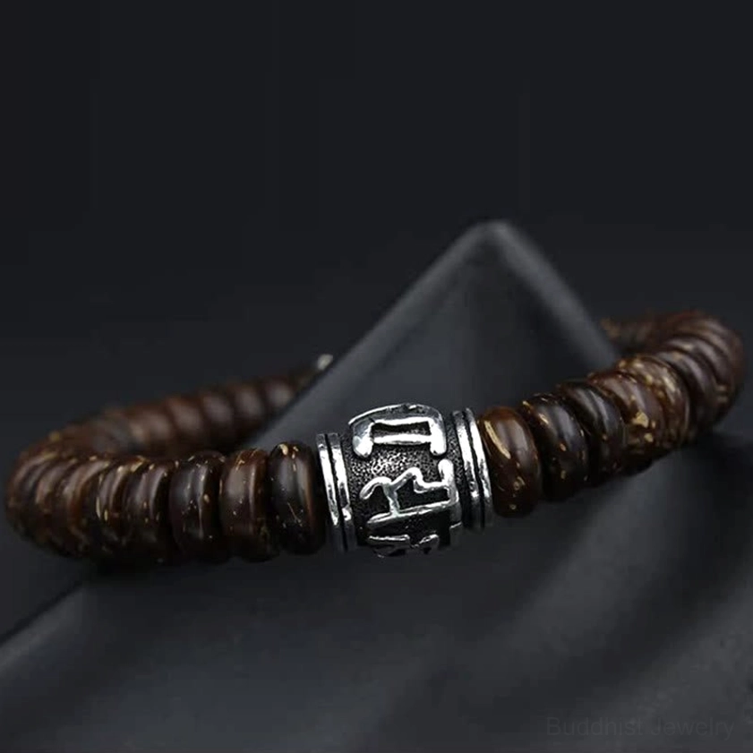 Brown and antique silver Om Mani Padme Hum Buddhist bracelet showing textured coconut disc beads