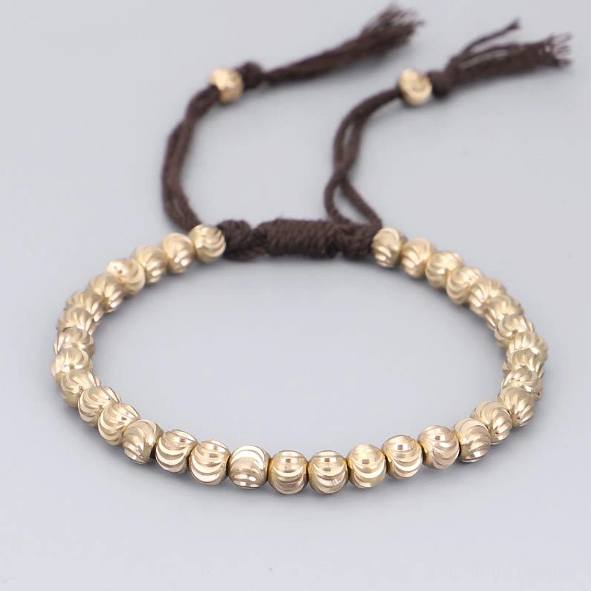 Dark brown handmade copper bead bracelet with smooth round copper beads and tassel
