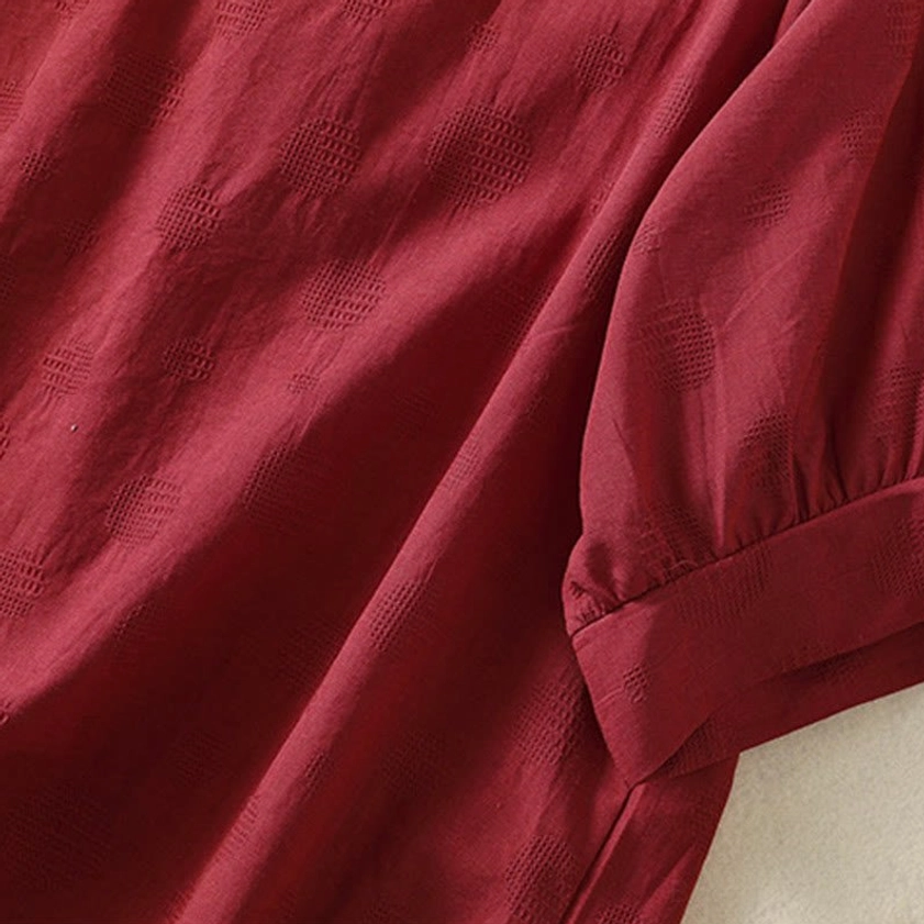 Back hem of brown meditation yoga blouse - rear detail showing curved hem and cotton construction