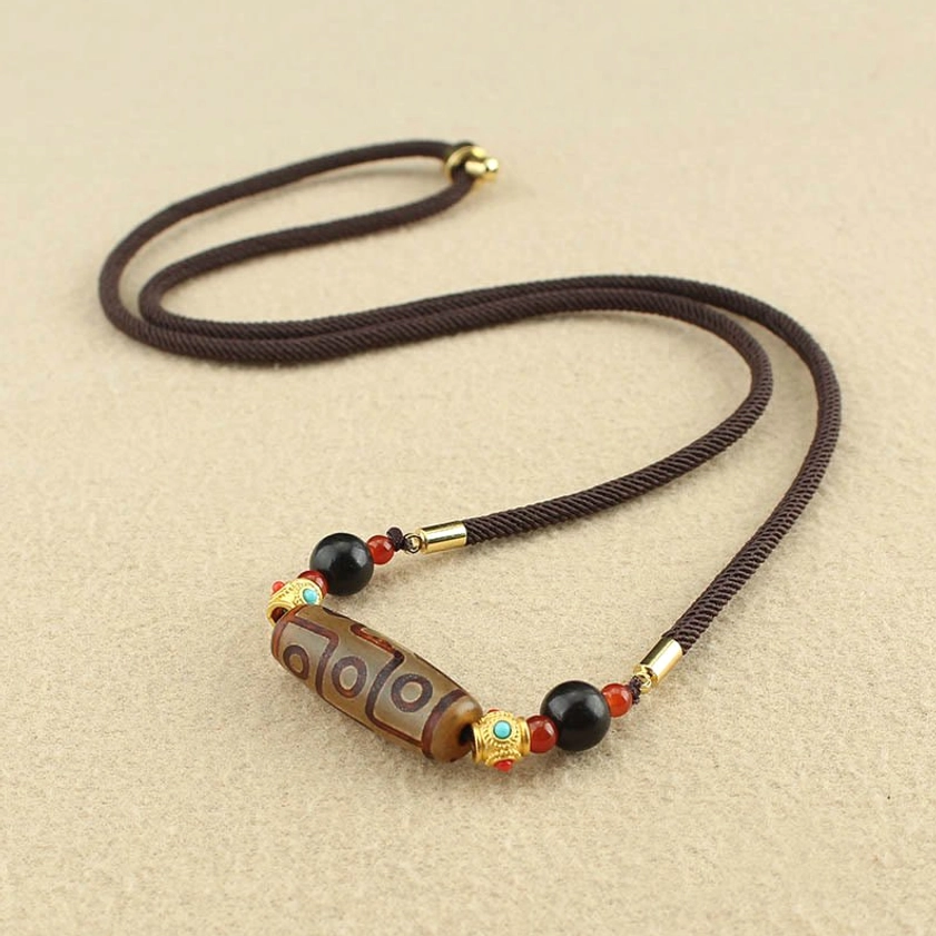 Brown Nine-Eye Dzi Bead Buddhist necklace pendant with woven cord and natural agate accents