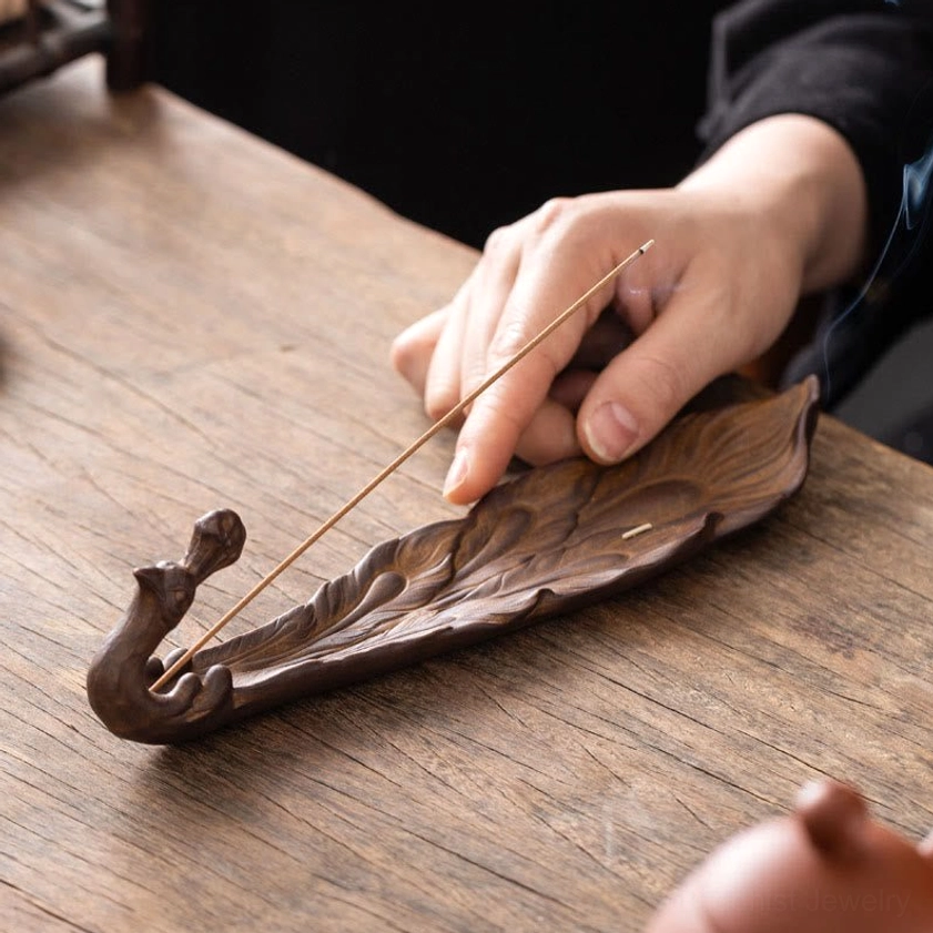 Brown peacock ceramic incense holder hand placing incense stick matte finish artisan