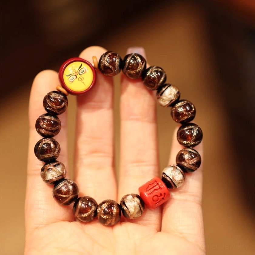 Brown and White Yellow God of Wealth Buddhist bracelet with mixed bead design and golden prosperity charm