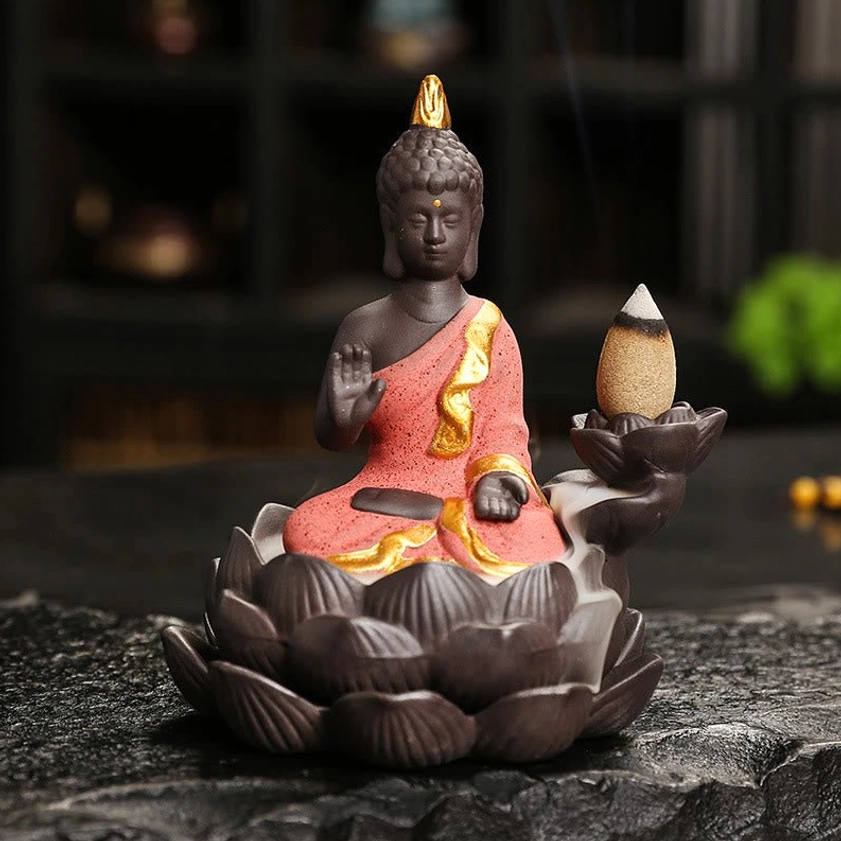 Buddha backflow incense burner right side profile with red-trimmed robe and prayer gesture mudra