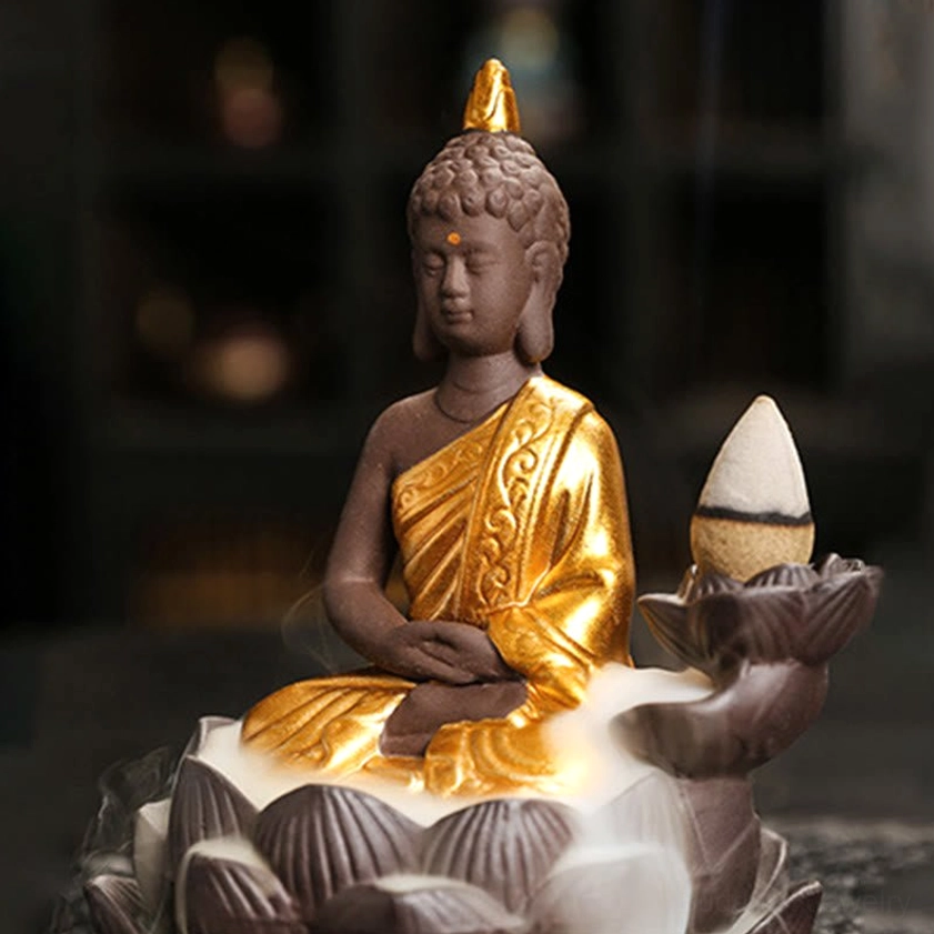 Ceramic Buddha burner right side angle displaying detailed golden robe and obvious cascading incense smoke effect