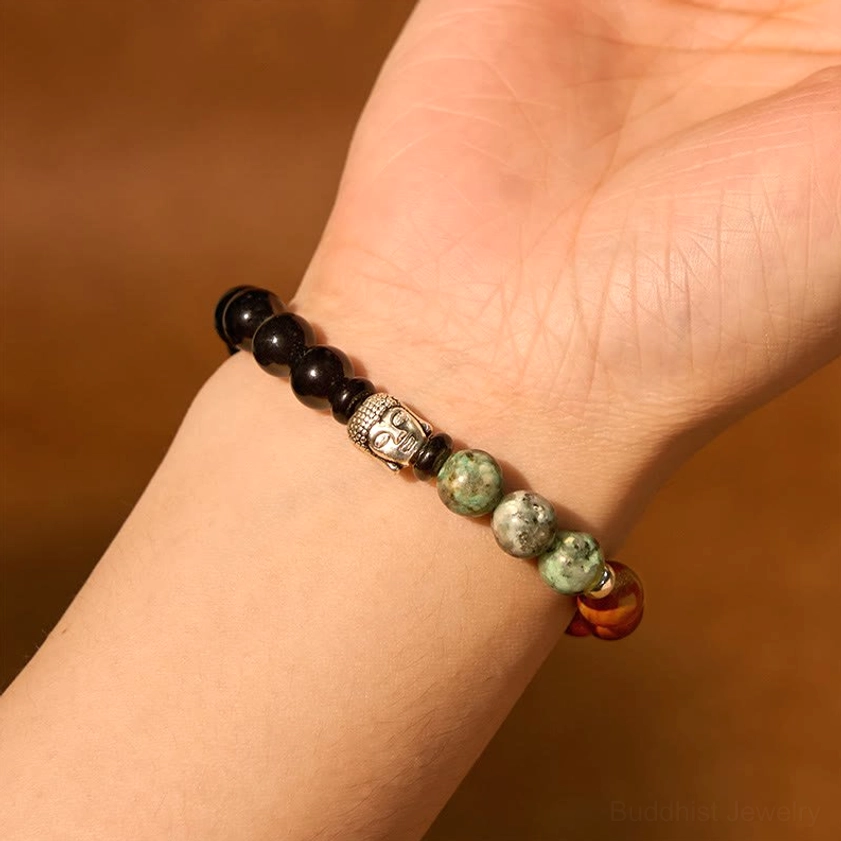 Mixed gemstone bracelet featuring Buddha charm on elastic cord for daily wear