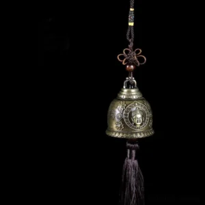 Buddha embossed handcrafted wind chime bell with bronze finish and Chinese knot tassel, front close-up view
