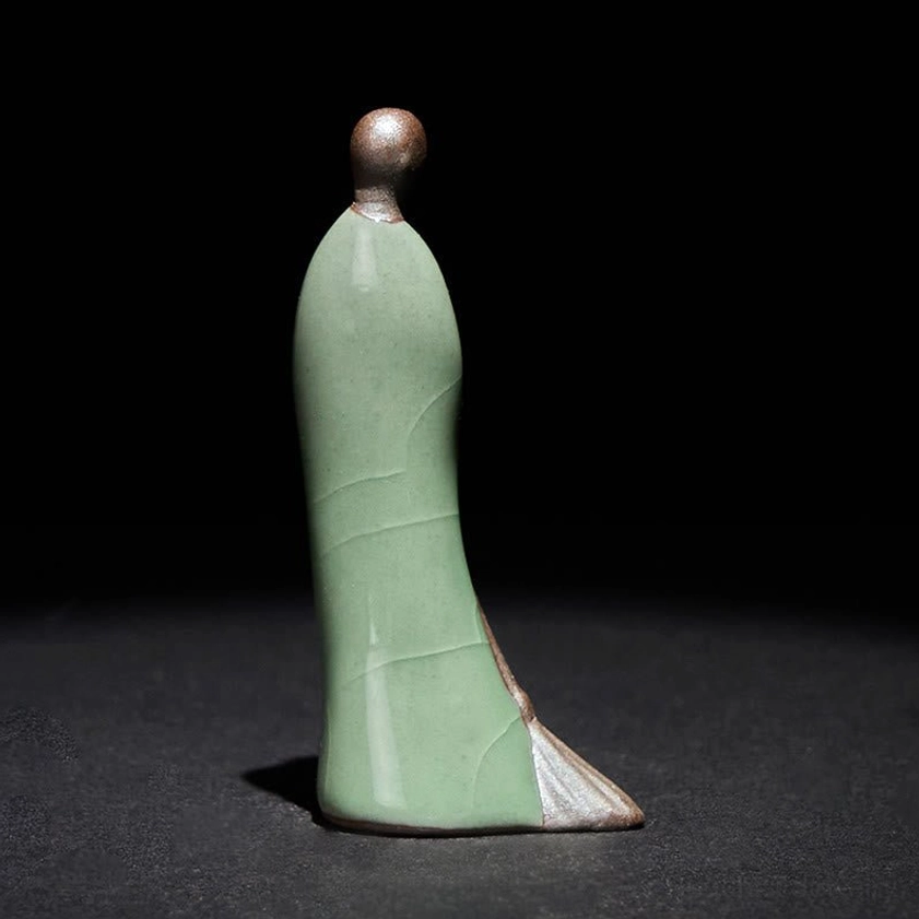 Premium glazed ceramic Buddha statue rear view with crackle glaze finish and bronze head details on black backdrop