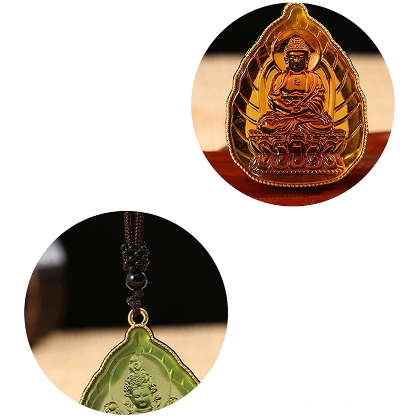 Two Buddhist Buddha crystal pendants in circular magnified views showing intricate embossed Buddha figures with different colored crystals and gold metal frames on white background