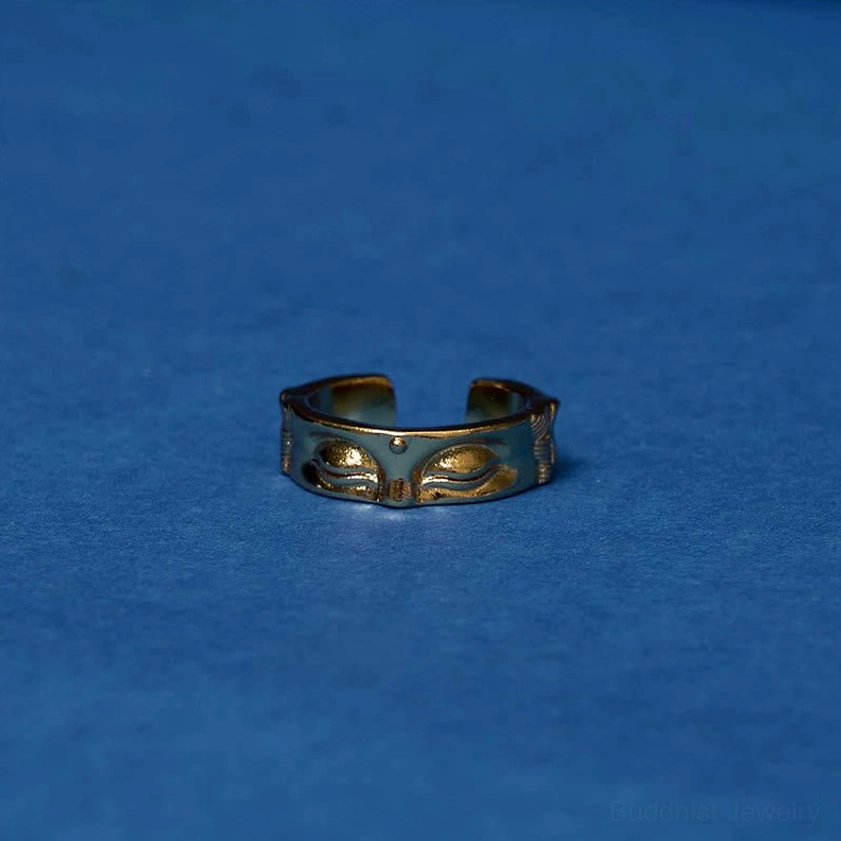 Buddha's eye adjustable meditation copper ring detailed close-up showing intricate embossed carving and golden polished finish