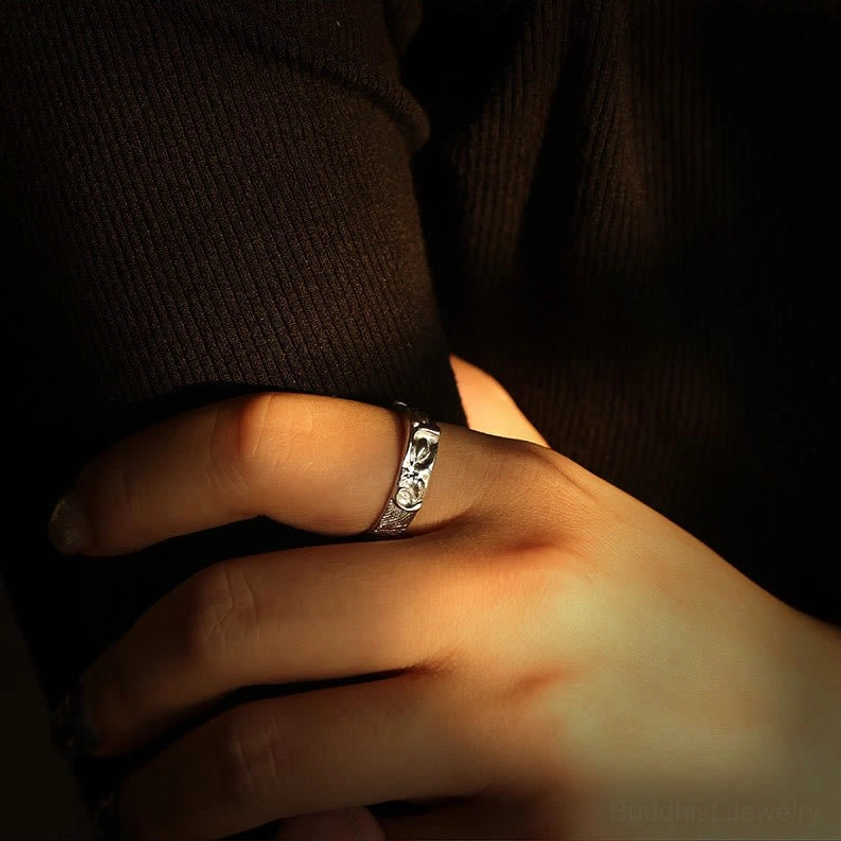 Sterling silver Buddha eyes wisdom ring featuring protective Buddhist symbolism and intricate artisan engraving