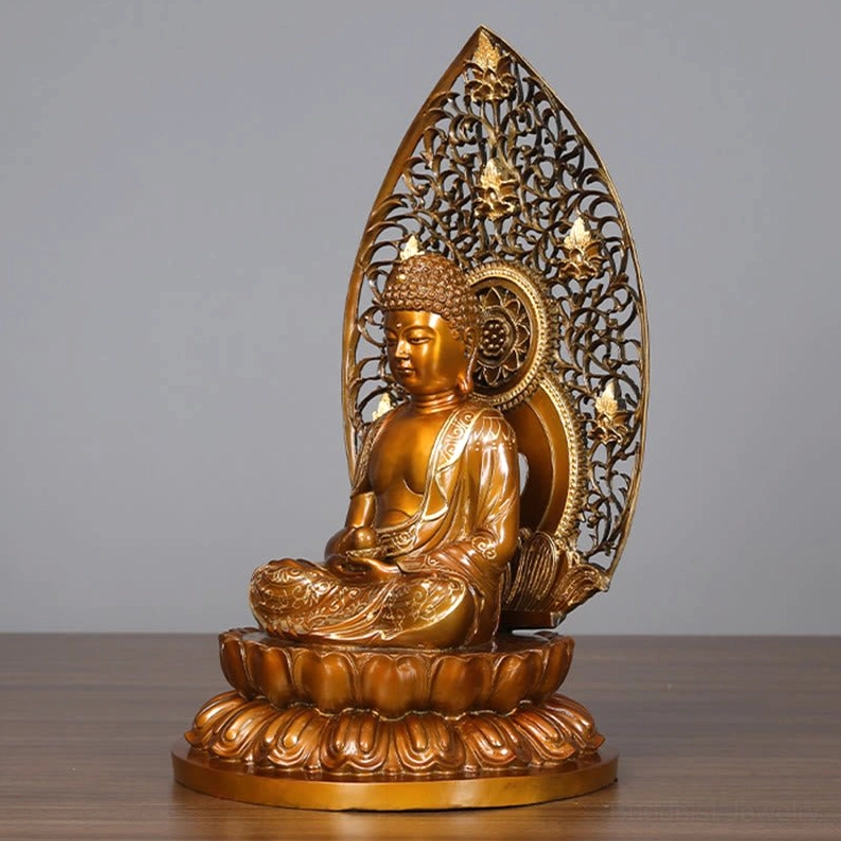 Buddha figurine right rear angle view - Holding sacred relic ball with profile meditation pose on wooden surface