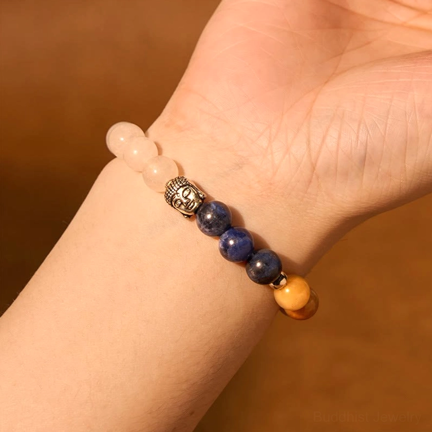 Buddha head bracelet with mixed gemstones arranged for maximum spiritual benefit