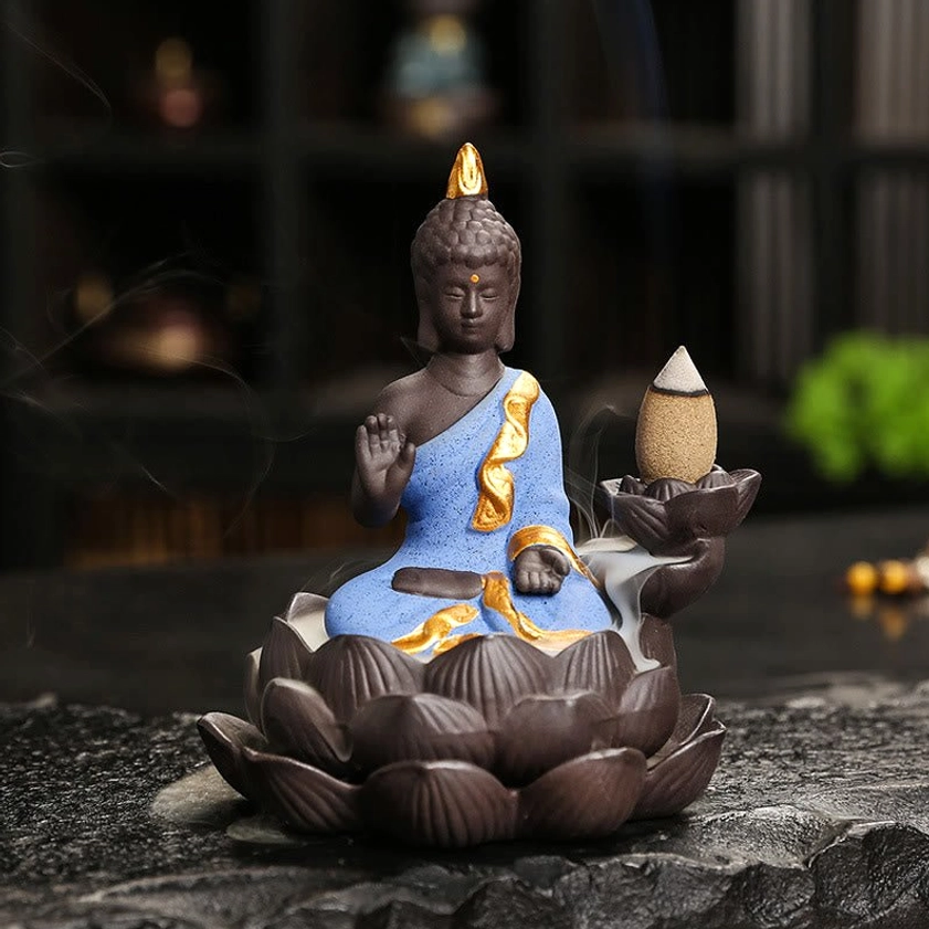 Golden ceramic Buddha burner with prayer blessing mudra expressing spiritual devotion and compassion