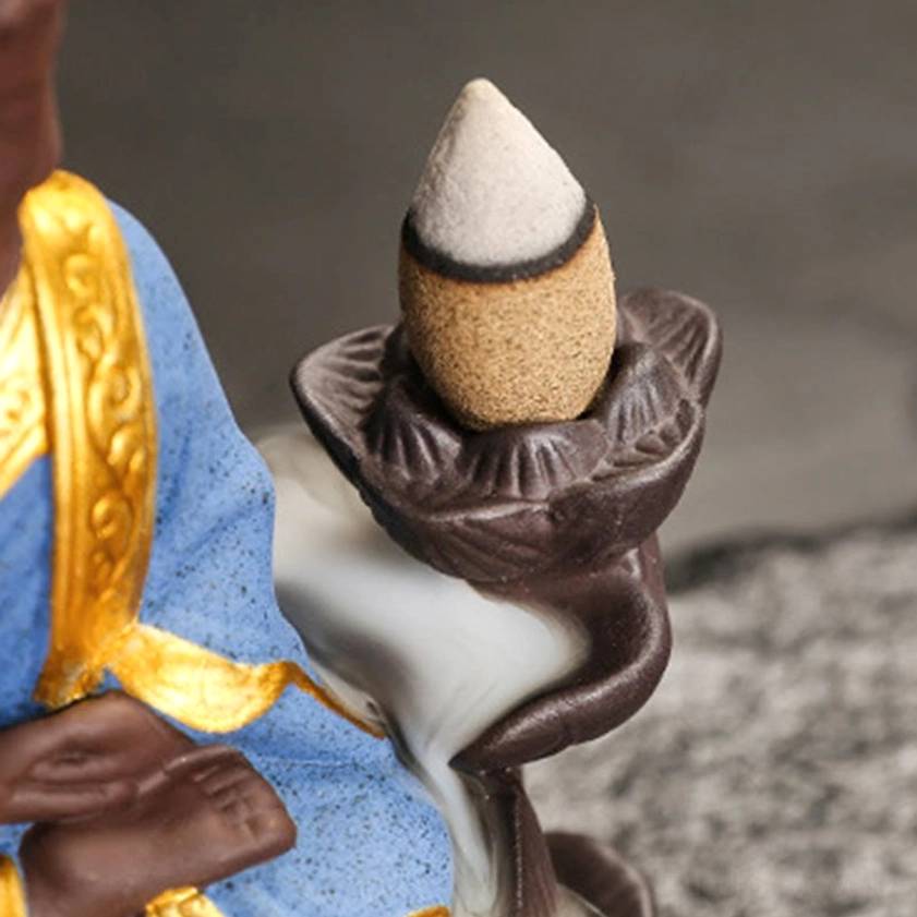 Green Buddha backflow incense burner in pondering contemplation pose with hand-painted ceramic robe