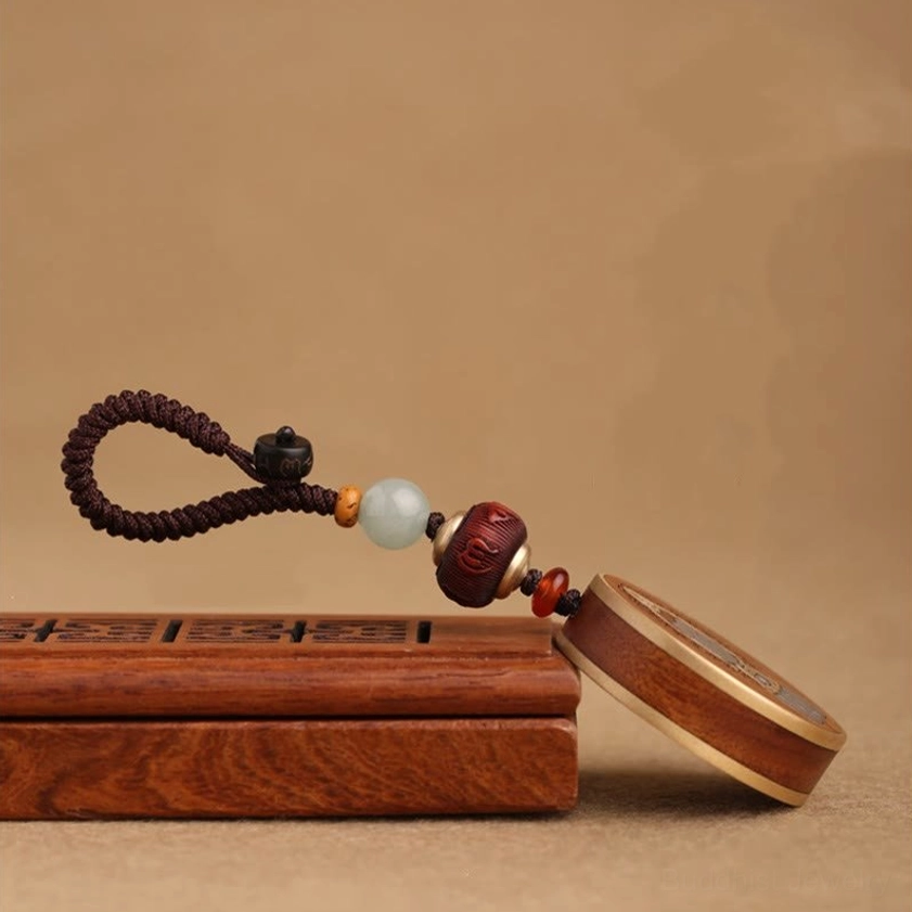 Buddha and Guanyin keychain pair showing dual design options for spiritual balance
