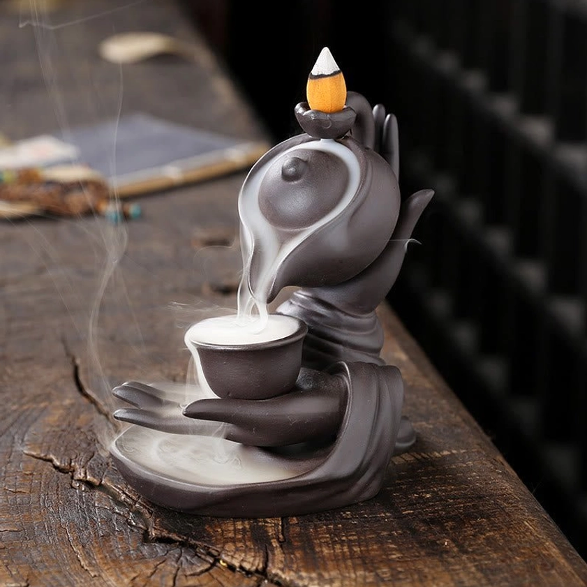 Buddha hand backflow incense burner ceramic teapot with brown-black finish showing cascading smoke effect
